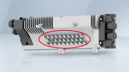 Figure 5: The bumps on the electronics housing (circled in red) improve cooling.